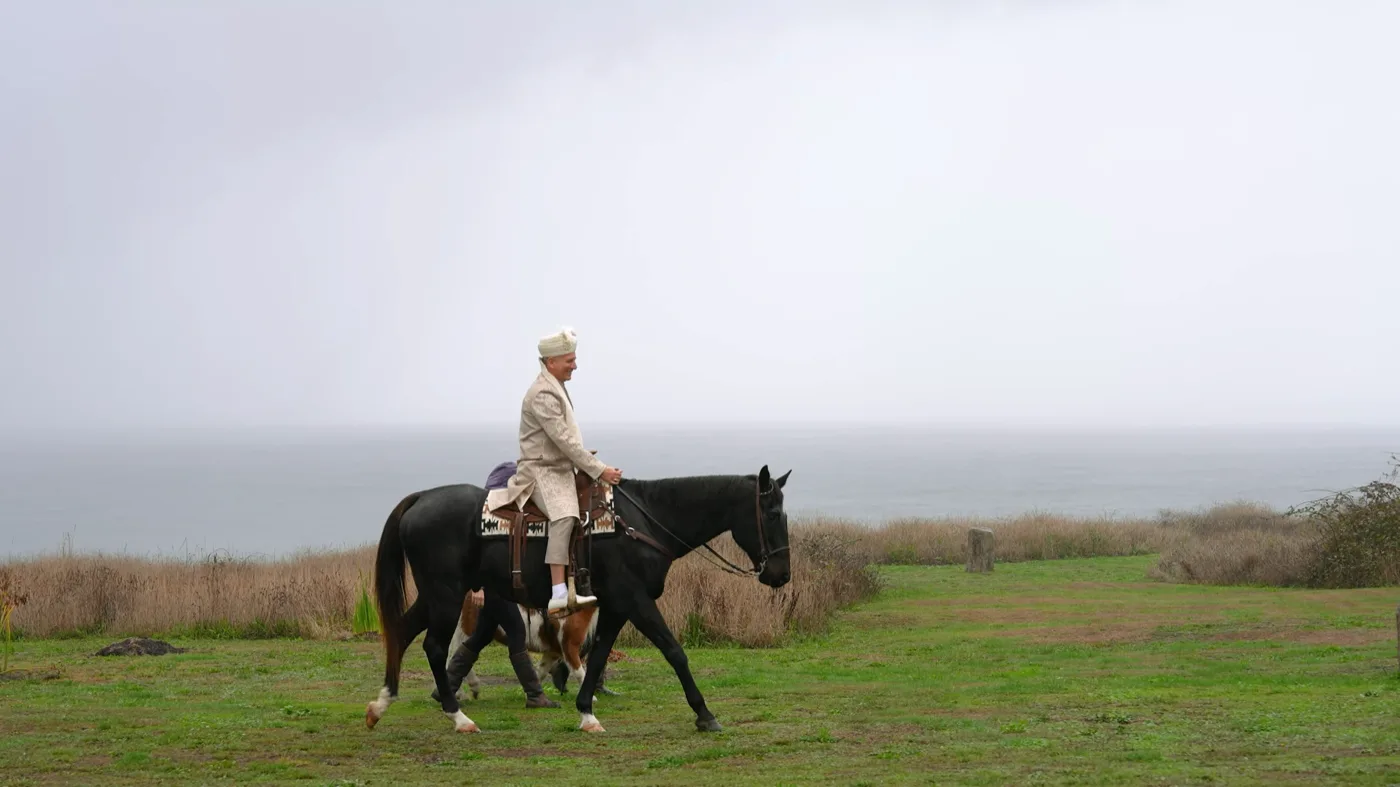 Rajni and Igor at sunset overlooking the Pacific Ocean at The Inn at Newport Ranch