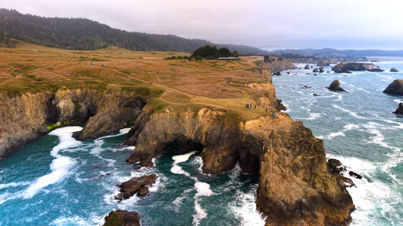 Couple surrounded by the expansive private coastal landscape of The Inn at Newport Ranch