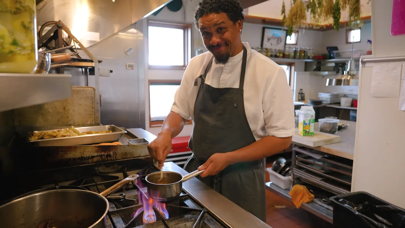 Executive Chef Nick Wells preparing food at The Inn at Newport Ranch