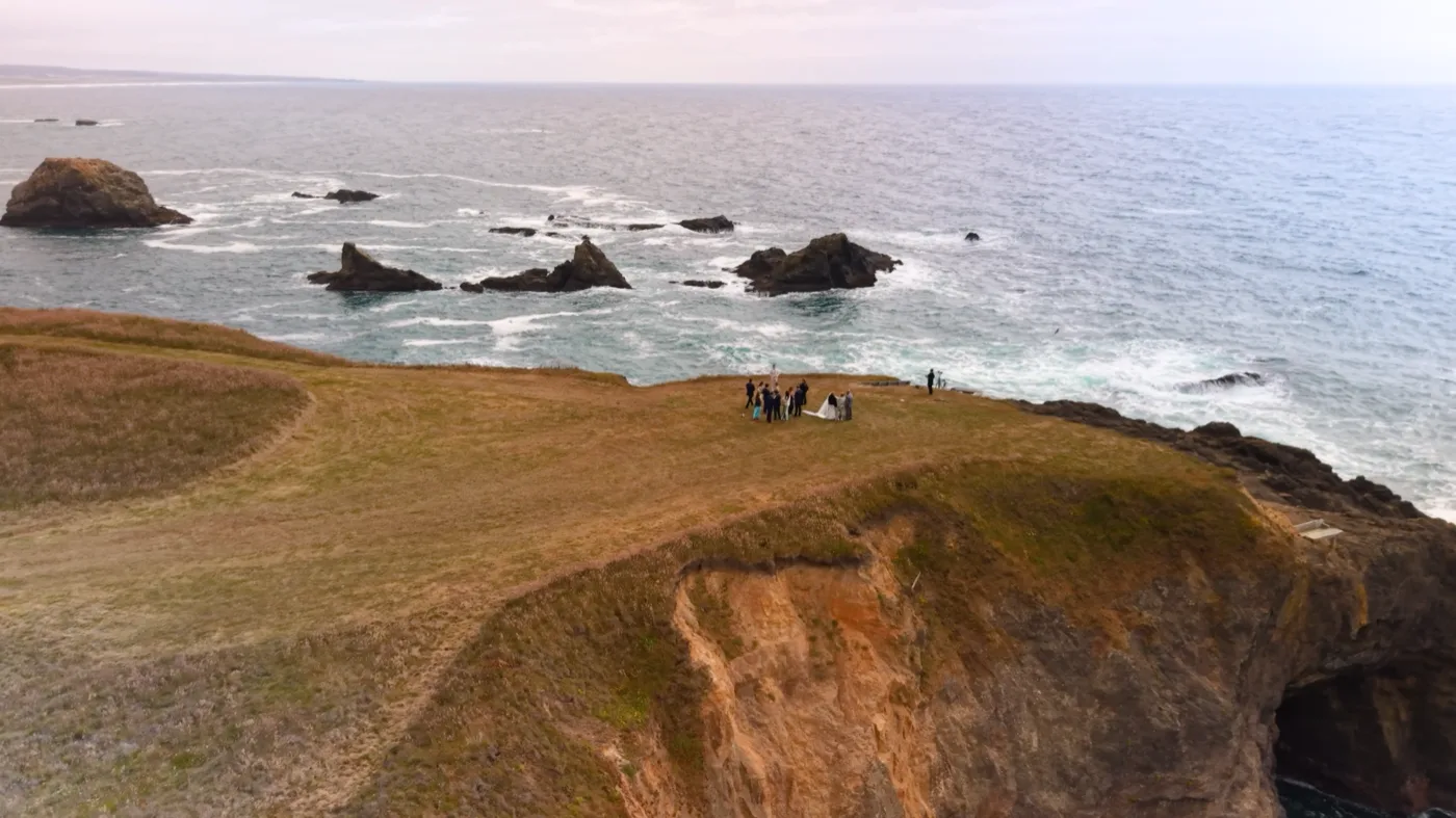 Intimate wedding ceremony surrounded by the expansive landscape at The Inn at Newport Ranch